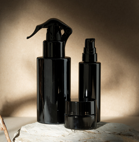Miron Premium Glass Packaging, Sustainable Protection for Beauty & Wellness Elegant black/purple Miron glass bottles and jars for skincare and cosmetics, designed to protect and preserve product freshness and potency.